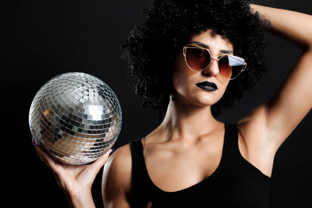 istock Curly girl with disco ball 853486288