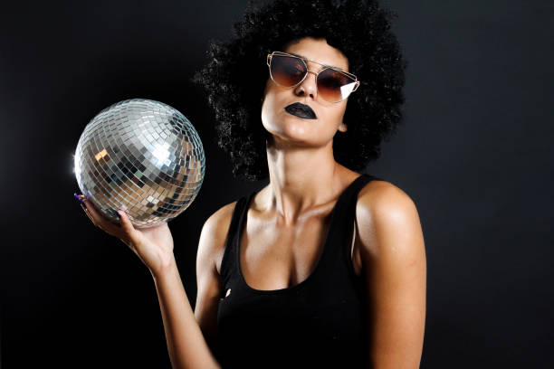 istock Curly girl with disco ball 853486530