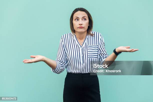 I Dont Know Handsome Blonde Businesswoman With Looking At Camera And Confused Stock Photo - Download Image Now