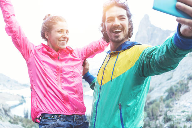 istock Happy couple taking self portrait in mountains 853517378