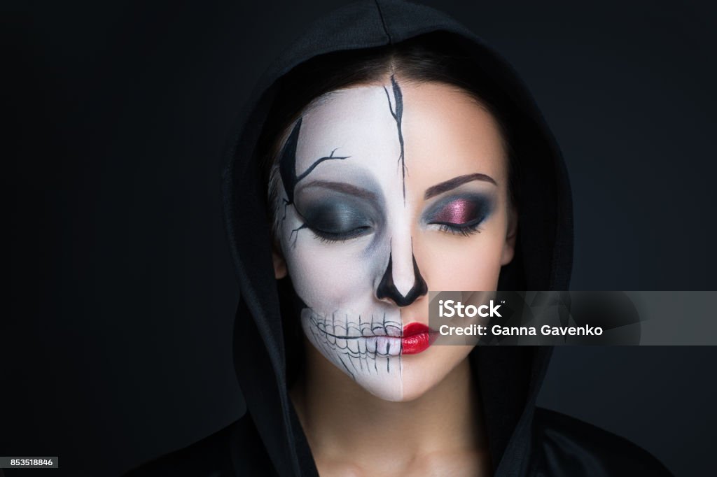 Horror make up woman monster. Creative dark make-up, conceptual idea for Halloween. Eerie nightmare turning into a black vampire, volume spikes body art painting. Professional photo darkness background horizontal Evil Stock Photo