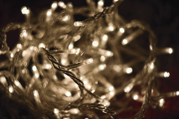 istock Close-Up Of White Festive Christmas Lights During Night 853521936
