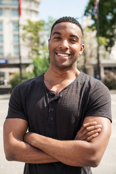 istock Handsome Afro-Caribbean man smiling in Central London 853522310