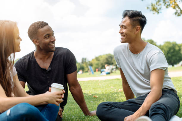 istock International group of students in London park 853531076
