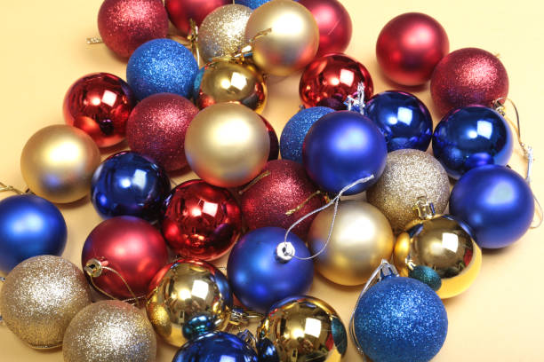 istock Christmas decorations with coloured balls on wooden background 853547756