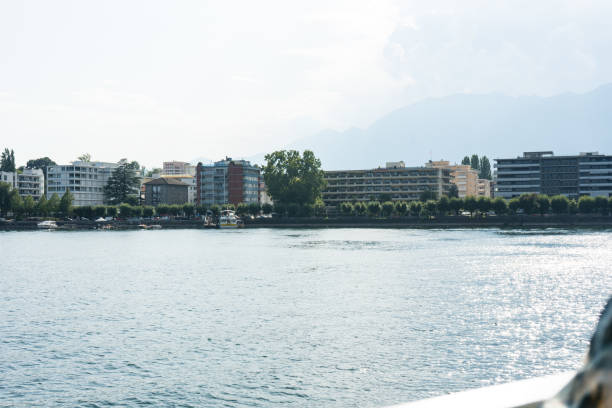 vista città di locarno dal lago maggiore con cielo blu e acqua - ticino canton immagine foto e immagini stock