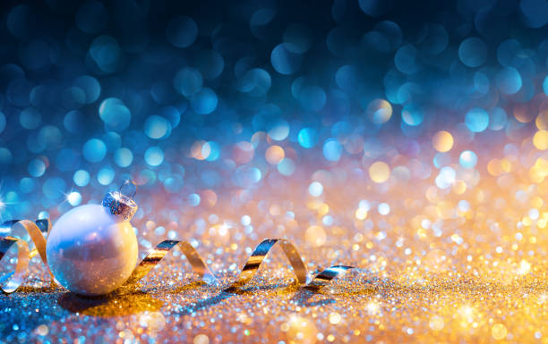 istock Christmas Ornaments On Glitter - Bokeh Golden Blue With ball 853551438