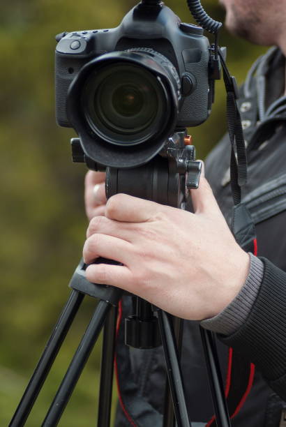 istock Modern camera with mic on tripod recording nature 853569026
