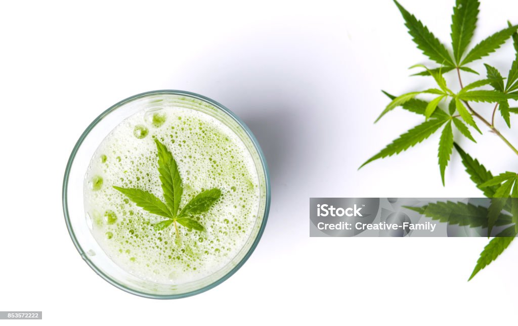 Green marijuana juice on white Green marijuana smoothie juice on white background Drink Stock Photo