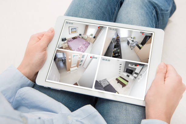 home camera cctv monitoring monitor system alarm smart house video home camera cctv monitoring monitor smart house video system hand exterior closeup concept - stock image indoor security camera stock pictures, royalty-free photos & images