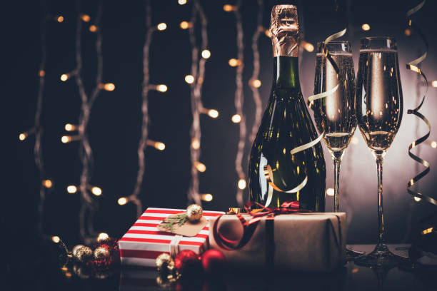istock glasses of champagne and presents 853573306
