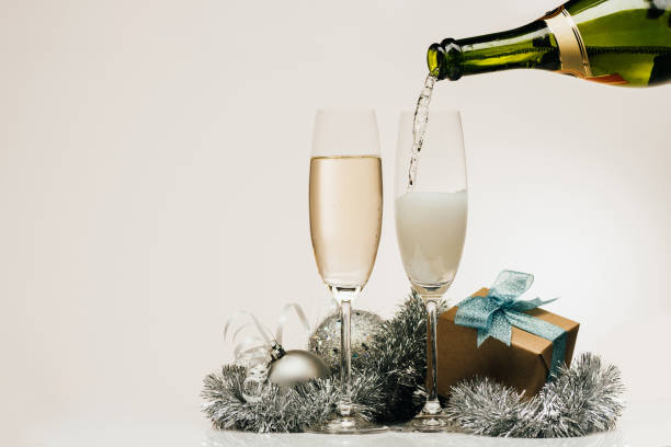 istock pouring champagne into wineglass 853575704