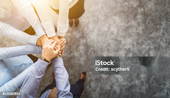 istock Stack of hands. Unity and teamwork concept. 853580852