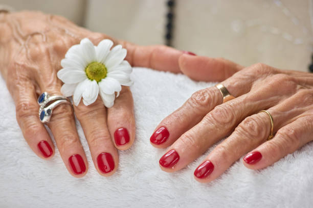 istock Woman hands with chrysanthemum after spa. 853597598