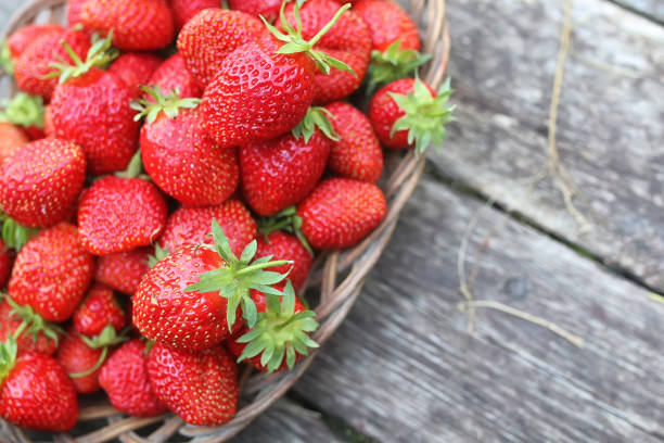 istock Strawberry on rustic wooden background 853598524
