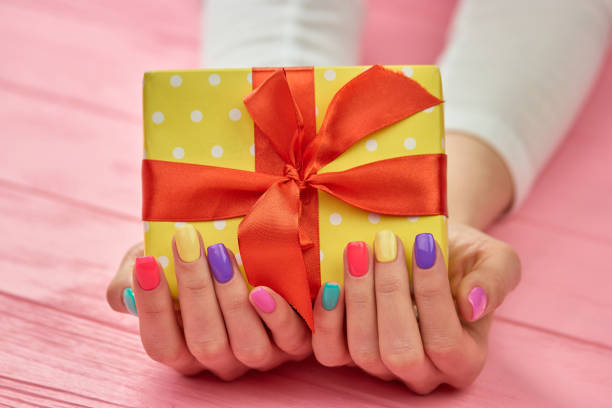istock Birthday box in female hands. 853602710