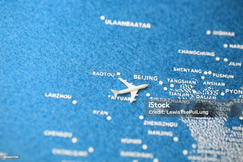 airplane fly on the blue painted map airplane fly on the blue painted map, northern china Commercial Airplane Stock Photo