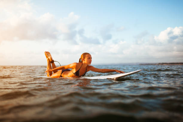 istock young surfer woman 853609602