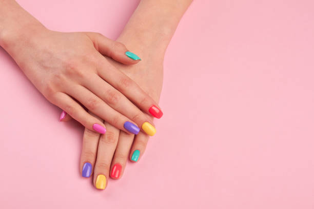 istock Female hands with stylish colorful nails. 853610198