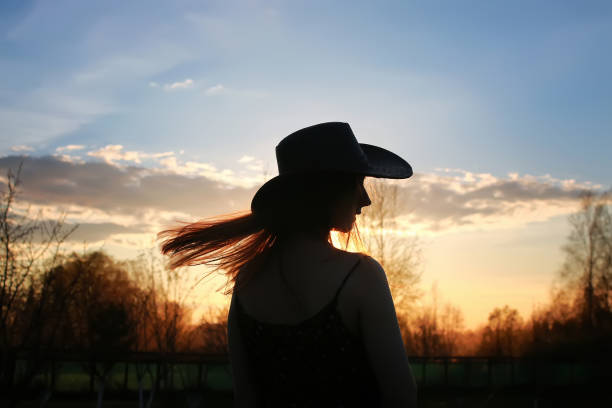 istock girl silhouette cowboy 853614698