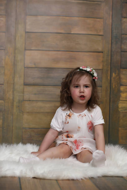 istock Little girl with curly hair, having fun while posing 853627140