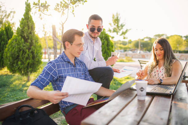 istock Happy business team working together in the park 853630842
