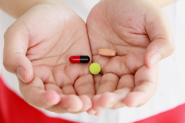 istock Pills medicine tablets in doctor hand 853633944