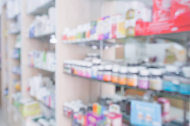istock pharmacy store interior with medicine on medical shelves blur background 853634484