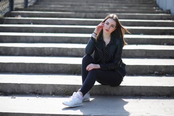 istock Girl on a walk through the spring city 853643362