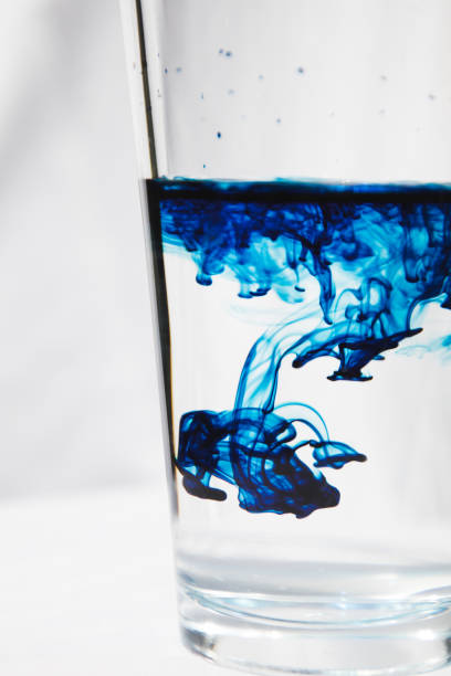 istock Clear Glass with Blue Food Coloring 853646226
