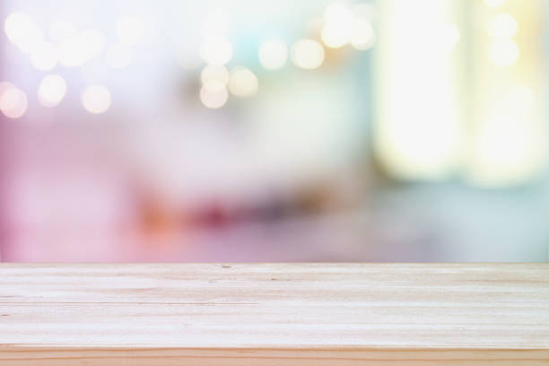istock empty table board and defocused bokeh lights background. product display and picnic concept 853646276