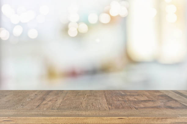 istock empty table board and defocused bokeh lights background. product display and picnic concept 853646362