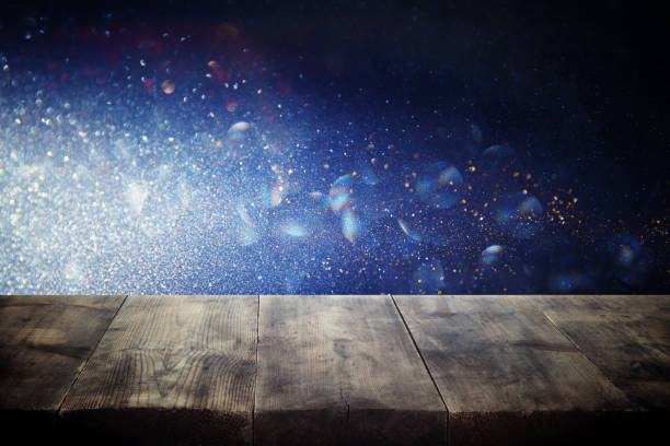 istock Empty table in front of blue glitter lights background. For product display montage. 853646416