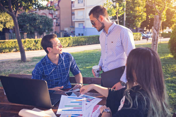 istock Business people working in park 853651894
