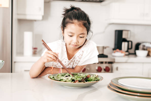 istock Girl in the kitchen 853652618