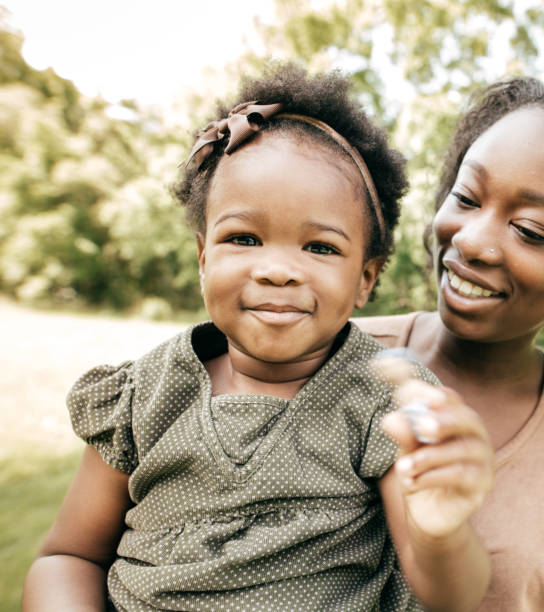 istock Playing outside the house with mom and dolls 853652748