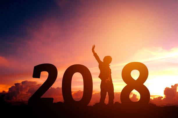istock Silhouette young man Happy for 2018 new year 853653096
