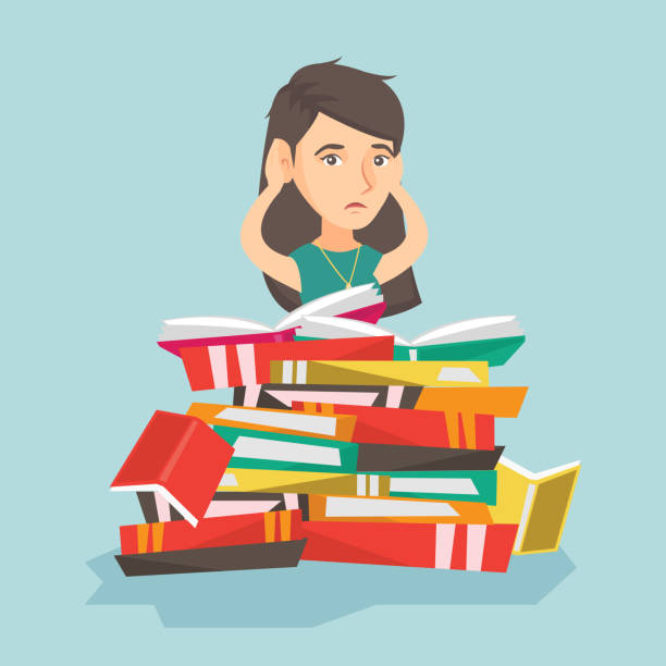 istock Caucasian student sitting in a huge pile of books 853659814