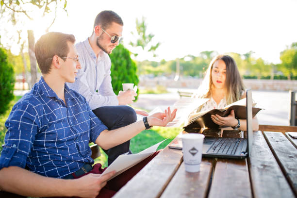 istock Business people working in park 853677398