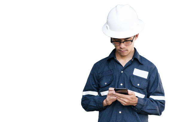 istock Asian man,Engineer or Technician in white helmet, glasses and blue working shirt suit holding smart phone, isolated on white, mechanic and Oil and Gas industrial concept with clipping path. 853684738
