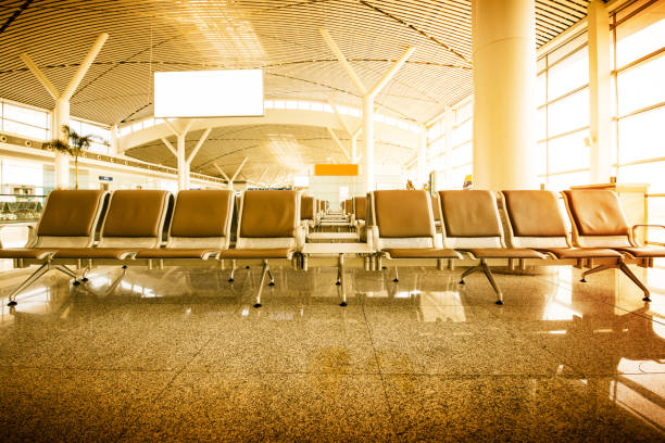 istock Empty airport terminal waiting area with chairs 853688802