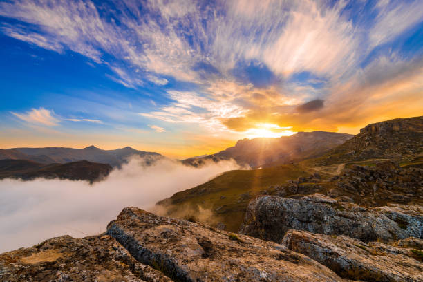 Sunrise over Peaks of Europe ridge with wooden fence, Cantabria,Spain.