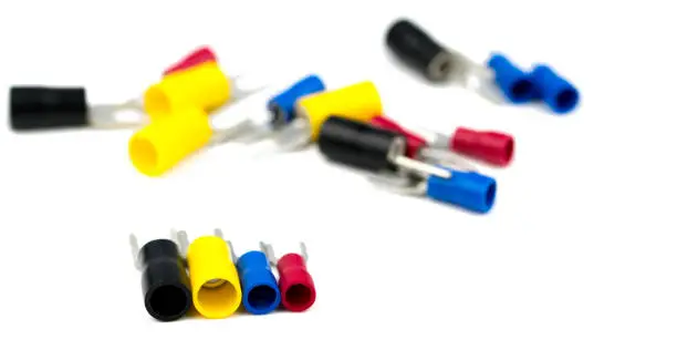 Photo of Spade terminals electrical cable connector accessories isolated on blur background