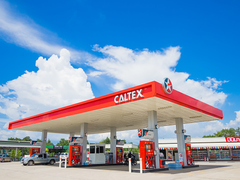 Trang Thailand - September 2 2017: Caltex gas station blue sky background. Caltex is a petroleum brand name of Chevron Corporation used in more than 60 countries.