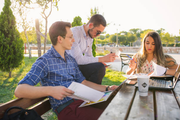 istock Happy business team working together in the park 853702050