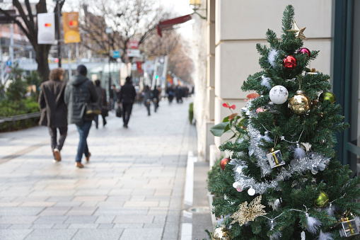 Tokyo, Japan - December 12, 2016: people walking through the sidewalk of Tokyo Harajyuku District in Christmas season