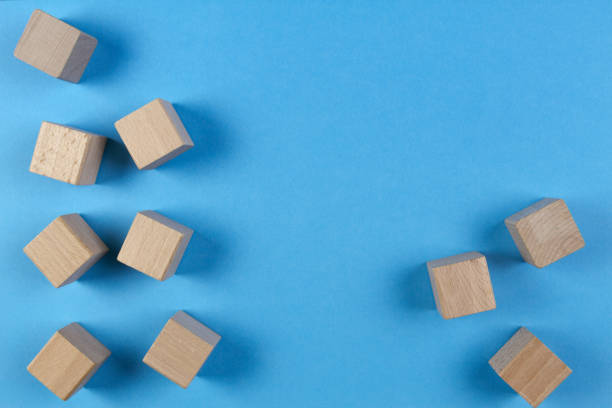 istock Wooden cubes on light blue background. Top view 853724160