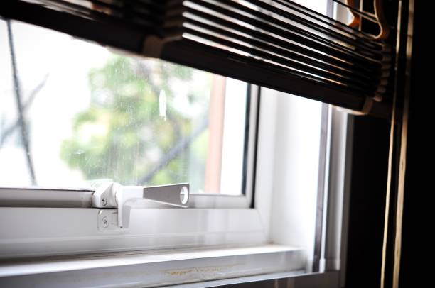 istock part of window blinds open in home, light from window outside image blurred background 853735938