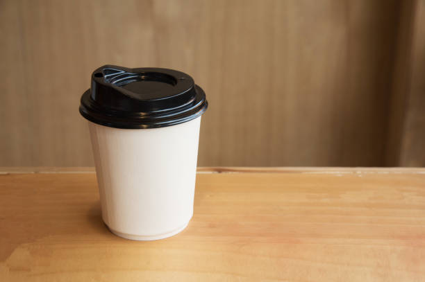 istock A cup of hot coffee on wooden background. 853736856