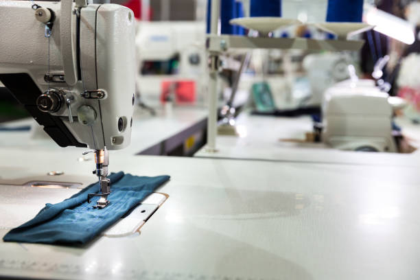 istock Sewing machine on textile fabric closeup, nobody 853737730